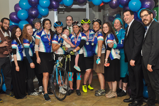 Cyclists who completed a 650-mile fundraising trek from West Bloomfield, Mich., to Borough Park, Brooklyn, celebrated at the Investors Bank branch at 13th Avenue and 47th Street with fellow cyclists and friends. They were raising funds for Friendship Circle, a Jewish organization that helps children with special needs.
