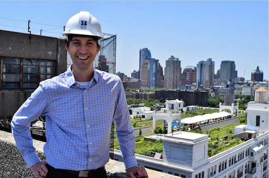 David Ehrenberg, Brooklyn Navy Yard Development Corp. president and CEO, shows us the view from the roof of Building 77, which is under renovation. Behind him, that's Brooklyn Grange, an urban farm on the roof of Building 3. Eagle photos by Rob Abruzzese