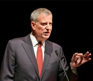 Housing was the focus of New York Mayor Bill de Blasio's speech on the nation's biggest city — but didn't make the top five concerns in smaller ones. AP Photo/Seth Wenig, File