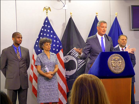 Mayor Bill de Blasio urged New Yorkers to take steps to keep themselves and vulnerable neighbors cool and hydrated at a press conference held in Brooklyn on Monday. Shown from left: Homeless Services Commissioner Gilbert Taylor, City Health Commissioner Dr. Mary Basset, Mayor Bill de Blasio, and Office of Emergency Management Commissioner Joseph Esposito. Photo by Mary Frost