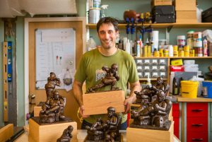 Sculptor Dave Mitri creates championship trophies for fantasy sports leagues in his Sunset park studio. Photo courtesy of Mitri