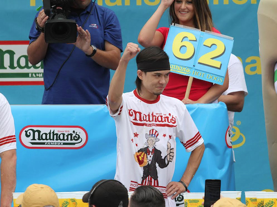 Matt Stonie gestures after winning the Nathan's Famous Fourth of July International Hot Dog Eating Contest men's competition, on Saturday in Coney Island. Stonie ate 62 hot dogs and buns in 10 minutes. AP Photo/Tina Fineberg