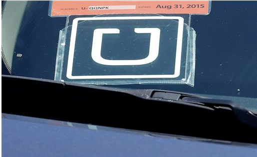 An Uber sign on one of their designated vehicles. AP Photo/Jeff Chiu