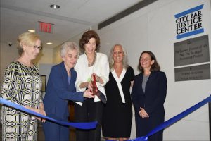 President of the New York City Bar Association Debra Raskin (second from left) and Chief Judge Carol Bagley Amon (center) help cut the ribbon to officially open the City Bar Justice Center on Tuesday, with Lynn Kelly (left), Hon. Lois Bloom (second from right) and Nancy Rosenbloom (right). Eagle photos by Rob Abruzzese