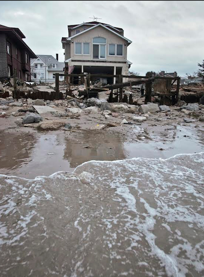 Shown are damages to a beachfront house in the Sea Gate community after Superstorm Sandy hit in October 2012. AP Photo/Bebeto Matthews