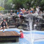 The Water Lab, Brooklyn Bridge Park’s most popular playground, features a water-jet field surrounded by greenery and smooth stones. Photos by Mary Frost