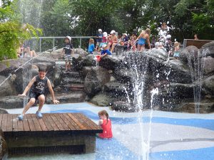 The Water Lab, Brooklyn Bridge Park’s most popular playground, features a water-jet field surrounded by greenery and smooth stones. Photos by Mary Frost