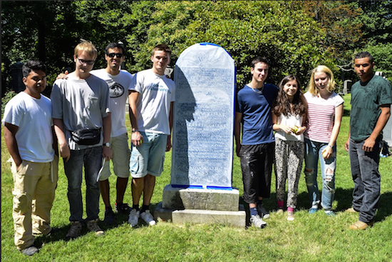 Students from Preservationist Volunteers helped restore a monument to a woman who lived to be 117 years old and had 22 children. From left: Arturo Juarez, Gauthier “Gerry” Lepers, Jerry de Labite, Antonin Dubois, Julien Bordas, Juliette Kaminski, Auriane Riehl and Nicholas Cruz. Eagle photos by Rob Abruzzese