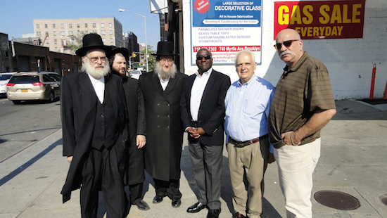 Rabbi Abe Perlstein, Samuel Stern, Simon Weiser, Department of Transportation Borough Commissioner Keith Bray, Assemblymember Joseph Lentol and Community Board One District Manager Gerry Esposito (left to right) conducted a site inspection of safety conditions at Wythe Avenue. Photo courtesy of Assemblymember Lentol’s Office