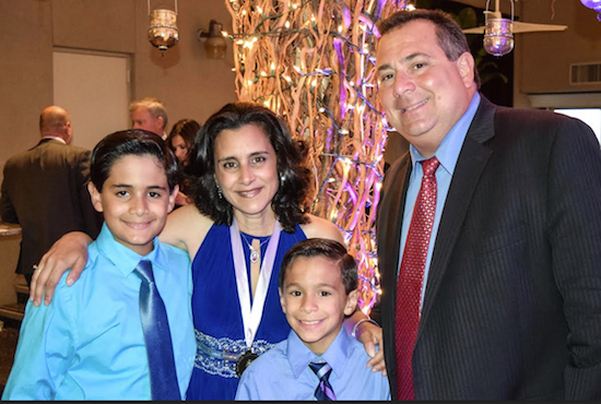 Lisa Becker with her husband Ralph Mercante and their two sons James (left) and Mark Mercante (right) during the annual Bay Ridge Lawyers Association (BRLA) dinner dance, where Becker was honored as the BRLA’s outgoing president. Eagle photo by Rob Abruzzese