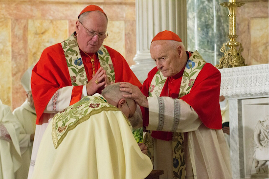 Theodore Cardinal McCarrick (right), archbishop emeritus of the Diocese of Washington, lays hands on new Auxiliary Bishop James Massa. Timothy Cardinal Dolan, archbishop of the Diocese of New York (at left) was also one of the co-consecrators. Brooklyn Eagle Photo by Francesca N. Tate