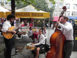 Summer Stroll on 3rd will bring music to the northern end of Third Avenue in Bay Ridge on Friday night. Last year, pedestrians enjoyed many musical groups, including this jazz trio. Eagle file photo by Paula Katinas