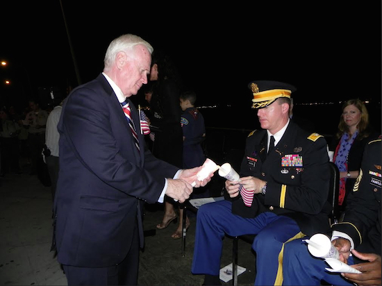 State Sen. Marty Golden (left) and Col. Joseph Davidson, commanding officer of the U.S. Army Garrison at Fort Hamilton, took part in a candlelight vigil during the Sept. 11 ceremony on the pier last year. Eagle file photo by Paula Katinas