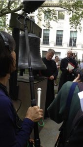 The Rev. Dr. William Lupfer rings the Bell of Hope outside St. Paul's Chapel in Lower Manhattan on the 14th anniversary of 9/11. Eagle photos by Lore Croghan