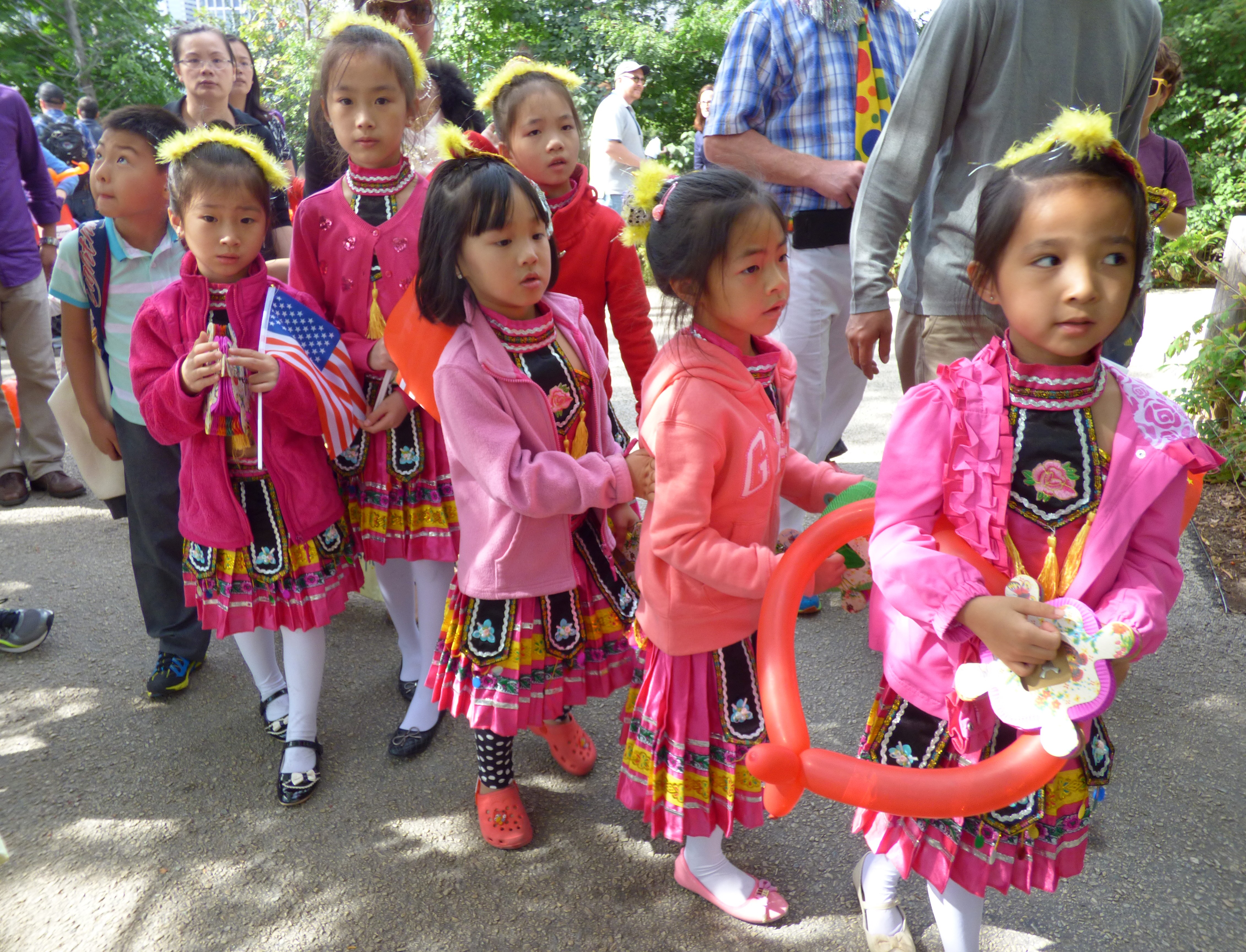 Children prance in the lantern parade.