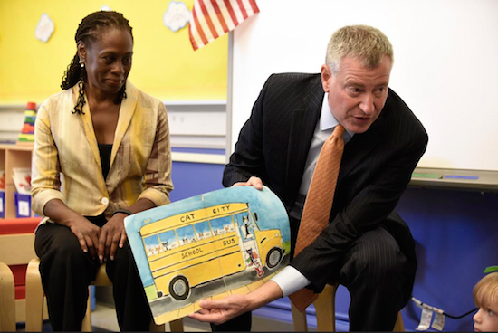 New York City Mayor Bill de Blasio reads a book to pre-K students on their first day of school, Sept. 9, at P.S. 59 in Staten Island as first lady Chirlane McCray listens. De Blasio unveiled the next phase of his education agenda this week. Barry Williams/New York Daily News via AP, Pool
