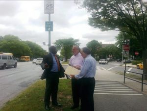 Assemblymember Dov Hikind (center) and an aide meet with Brooklyn Transportation Commissioner Keith Bray (left) at the intersection of Ocean Parkway and Bay Parkway to discuss safety improvements. Photo courtesy of Hikind’s office