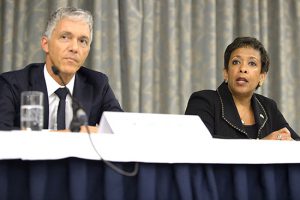 Michael Lauber, attorney general of Switzerland, left, and Loretta Lynch, attorney general of the U.S., right, arrive for the a news conference on soccer related criminal proceedings, in Zurich, Switzerland, on Monday. Lynch says she expects more indictments in a widening investigation of corruption implicating FIFA.