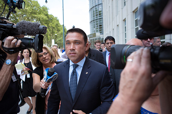 Former U.S. Rep. Michael Grimm, center, is pictured following his sentencing at federal court on July 17 in Brooklyn. Grimm, who represented southwest Brooklyn and Staten Island, has now reported to a prison in western Pennsylvania to begin his eight-month sentence for tax evasion.