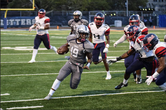 Jordan Hannah (19) hadn’t played quarterback in years, but looked like a veteran in his first varsity game as he threw for 144 yards, including one touchdown pass, and ran for another 92. He and the Lincoln Railsplitters are now 1-0 on the season after they beat Erasmus Hall 24-14 in a rematch of last year’s championship game. Eagle photos by Rob Abruzzese.