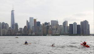 Martin Strel approaches the Freedom Tower in Downtown Manhattan as he swims from the Statue of Liberty to North Cove Marina on Sept. 10. On March 22, 2016, World Water Day, Strel will commence his "Strel World Swim" through 107 countries in approximately 450 days as a means of spreading clean water awareness. Photo by Stuart Ramson/Invision for Martin Strel/AP Images