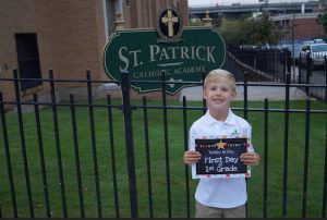 One student held a sign to mark the historic occasion in his life. Photo courtesy of Saint Patrick Catholic Academy