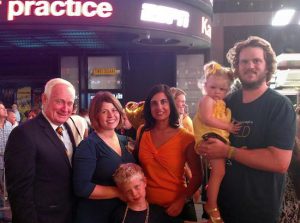 State Sen. Marty Golden (left) and Assemblymember Nicole Malliotakis (second from right) attended the Times Square Go Gold lighting. They were joined by the Kabel family of Bay Ridge; dad Matthew (holding daughter Sally), mom Nicole and son William. Photo courtesy of Malliotakis’s office