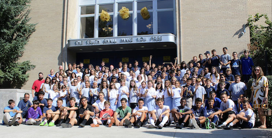 Students from Genesis placed a gold ribbon around the entire perimeter of their school. Photo courtesy of Xaverian High School