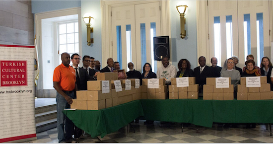 Faith leaders from food ministries at churches and organizations around Brooklyn receive donations of meat, thanks to Brooklyn Borough President Eric Adams (sixth from left) and the Turkish Cultural Center-Brooklyn. Brooklyn Eagle photo by Francesca N. Tate