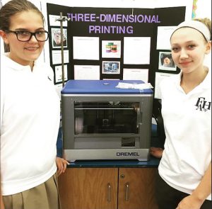 Students from Fontbonne Hall Academy are helping girls from Visitation Academy become acquainted with STEM. Photo courtesy of Fontbonne Hall Academy
