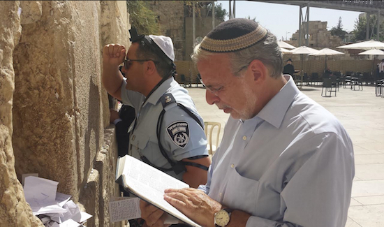 Assemblymember Dov Hikind (right) prays at the Western Wall during his trip to Israel. Photos courtesy of Hikind’s office