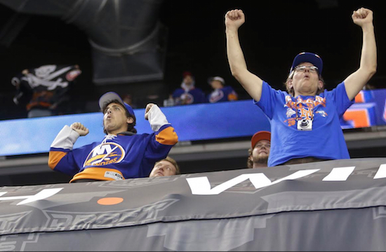 Islander fans whoop it up in Brooklyn Monday night as New York improved to 4-1-1 at Barclays Center with a 4-0 victory over the visiting Calgary Flames. AP photo