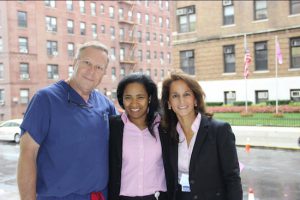 Dr. Patrick Borgen, chair of surgery and director of the Maimonides Breast Center; Dr. Donna Marie Manasseh, chief of breast surgery; and Dr. Christina Giuliano, chief of breast imaging, stand outside the hospital on 10th Avenue after the pink flag was raised in honor of Breast Cancer Awareness Month. Photos courtesy of Maimonides Medical Center