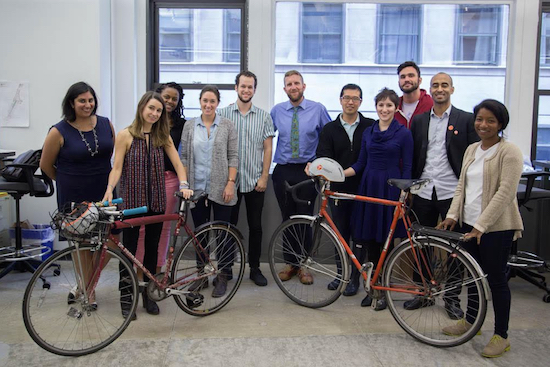Paul White (middle), executive director of the nonprofit Transportation Alternatives, poses with other employees at the organization’s Chelsea office. Transportation Alternatives continues to work toward making Brooklyn a more pedestrian- and biker-friendly place, White said. “For me personally, the heart and soul of this organization is in many ways in Brooklyn,” he added. Eagle photo by Louise Wateridge