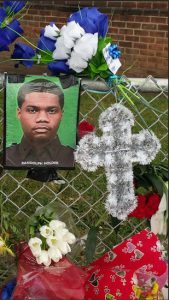 A memorial honoring slain NYPD Officer Randolph Holder is attached to a fence of the Wagner housing project. Holder's fiancée Mary Muhammad says she hopes to launch a foundation in his name. AP Photo/Verena Dobnik