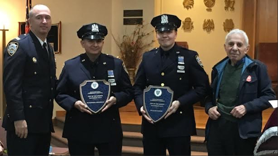 Eighty-fourth Precinct Capt. Sergio Centa (left) and Community Council President Leslie Lewis (right) honored Gustavo Jaramillo (second from left) and Alex Guess (second from right) as the Cops of the Month. Photo courtesy of the 84th Precinct Community Council