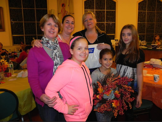 The fundraiser drew a large crowd, including young Angelia Lubrano and Shelia Dhamija (front) and Ann Kelly, Deborah Gillick-Powers, Donna Russo-Lubrano and Ava Ford (rear left to right). Eagle photo by Paula Katinas