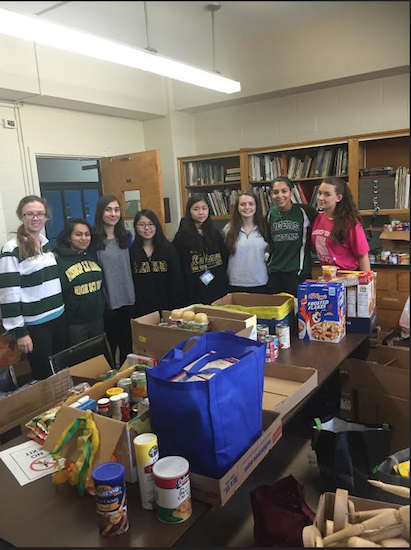 Members of the Student Council sorted and packed the food to be delivered to underprivileged families. Photo courtesy of Bishop Kearney High School