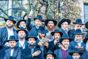 Chabad-Lubavitch rabbis are seen among a sea of black hats as they gather for a group photo in front of the Chabad-Lubavitch world headquarters in Crown Heights on Sunday. Photos: Eliyahu Parypa / Chabad.org