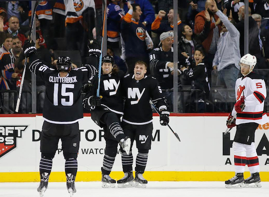 The Islanders’ hard-working fourth line, featuring (from left) Cal Clutterbuck, Matt Martin and Casey Cizikas, lifted New York to a 2-1 victory over New Jersey Tuesday night at Downtown’s Barclays Center. AP Photo