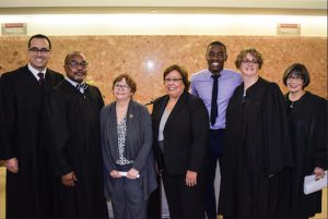 Brooklyn’s Family Court celebrated Adoption Day by finalizing nearly 70 adoptions last Thursday. From left: Hon. Adam Silvera, Hon. Franc Perry, Commissioner Gladys Carrión, Hon. Jeanette Ruiz, Demetrius Johnson, Hon. Amanda E. White and Hon. Susan S. Danoff. Eagle photos by Rob Abruzzese