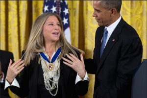 President Barack Obama, right, presents the Presidential Medal of Freedom to Brooklyn native Barbra Streisand during a ceremony in the East Room of the White House on Tuesday. AP Photo/Evan Vucci