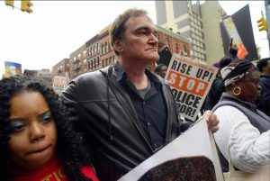 Director Quentin Tarantino, center, participates in a rally to protest against police brutality in New York on Oct. 24. AP Photo/Patrick Sison, File