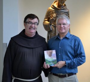 Father Brian Jordan, OFM, with Professor John Dilyard. Photo courtesy of St. Francis College