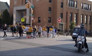 And they’re off! With a police escort, students begin their walk-a-thon outside the school on Fourth Avenue and 97th Street. Photos courtesy of St. Patrick Catholic Academy