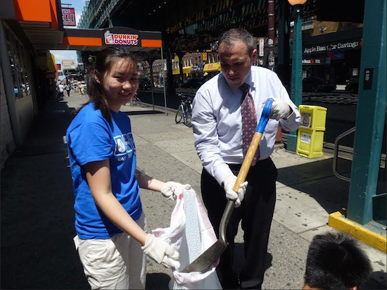Councilmember Mark Treyger, shown with a volunteer, organized a cleanup effort with Assemblymember Bill Colton on 86th Street in Bensonhurst last year. Photo by Priscilla Consolo