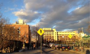 The golden-hued Watchtower headquarters building (right) is for sale; The Jehovah's Witnesses have not yet put red-brick buildings 50 and 58 Columbia Heights (left) on the market. Eagle photos by Lore Croghan