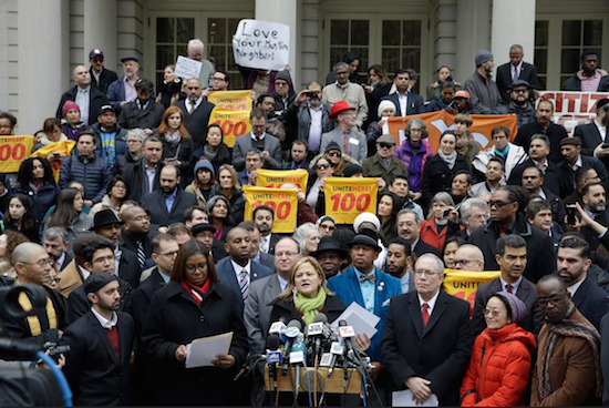 New York City Council Speaker Melissa Mark-Viverito, center, speaks during an interfaith rally at City Hall in response to Republican presidential candidate Donald Trump's call to block Muslims from entering the U.S. on Wednesday. Also pictured on Mark-Viverito’s left and right are Public Advocate Letitia James and City Comptroller Scott Stringer, among numerous other politicians. AP Photo/Mary Altaffer