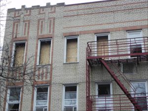 The windows of the 79th Street apartment where the fire took place have been boarded up. Eagle photo by Paula Katinas