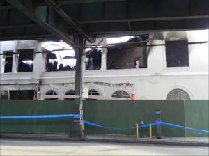 The fire destroyed the interior of the two-story building and disrupted service on the D train. Eagle photo by Paula Katinas